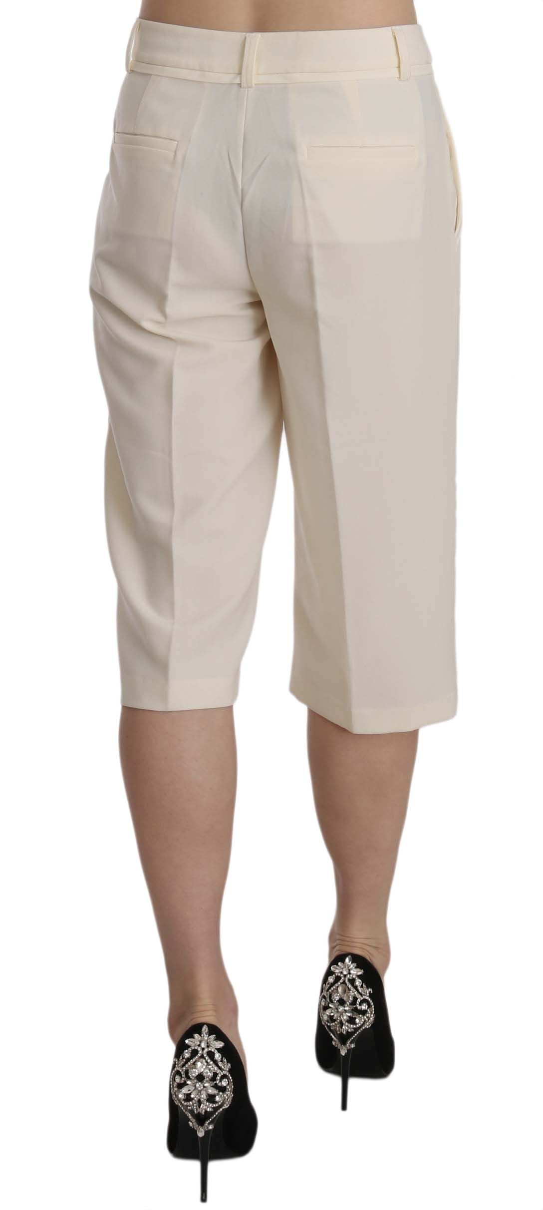 Pantalones rectos elegantes de corte crop en color crema