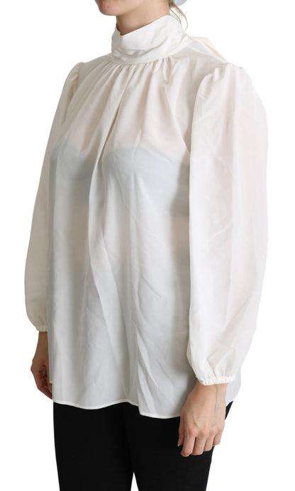 Elegante blusa de seda blanca con lazo en el cuello