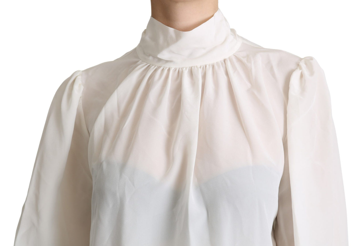 Elegante blusa de seda blanca con lazo en el cuello