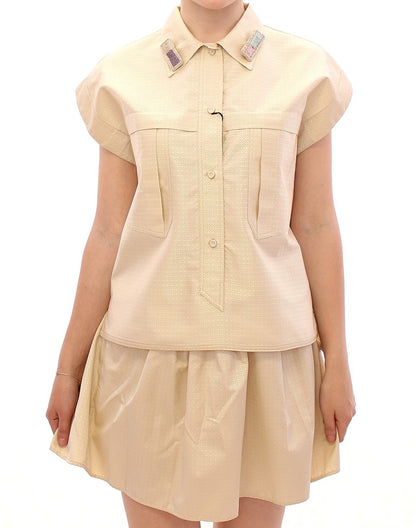 Elegante blusa sin mangas color beige