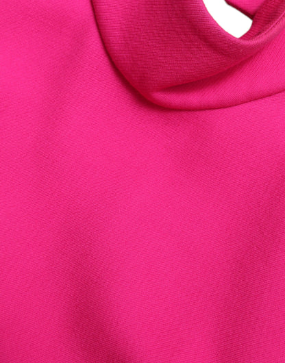 Elegante blusa de lana sin mangas con cuello alto en color rosa