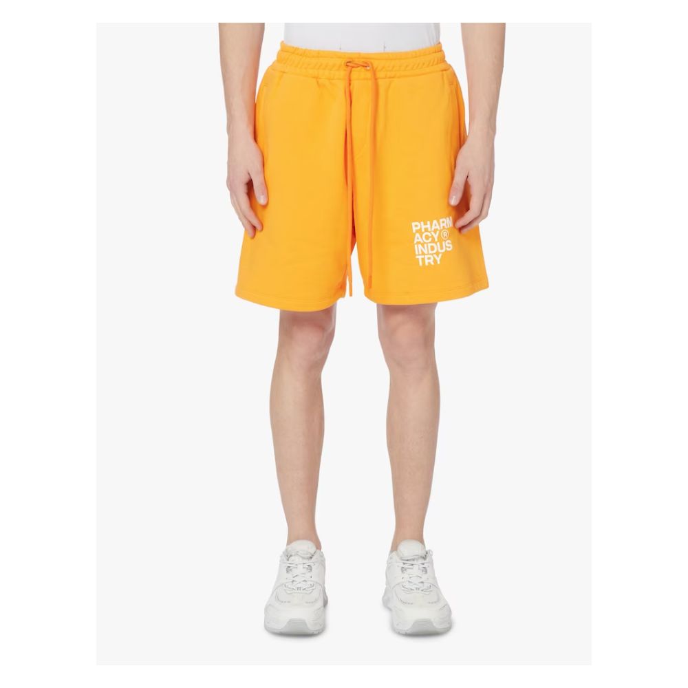 Pantalones elegantes de algodón de color naranja con detalle de logotipo