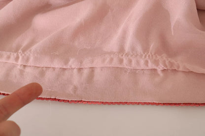 Rosa Kleid mit Blumenmuster und Pailletten