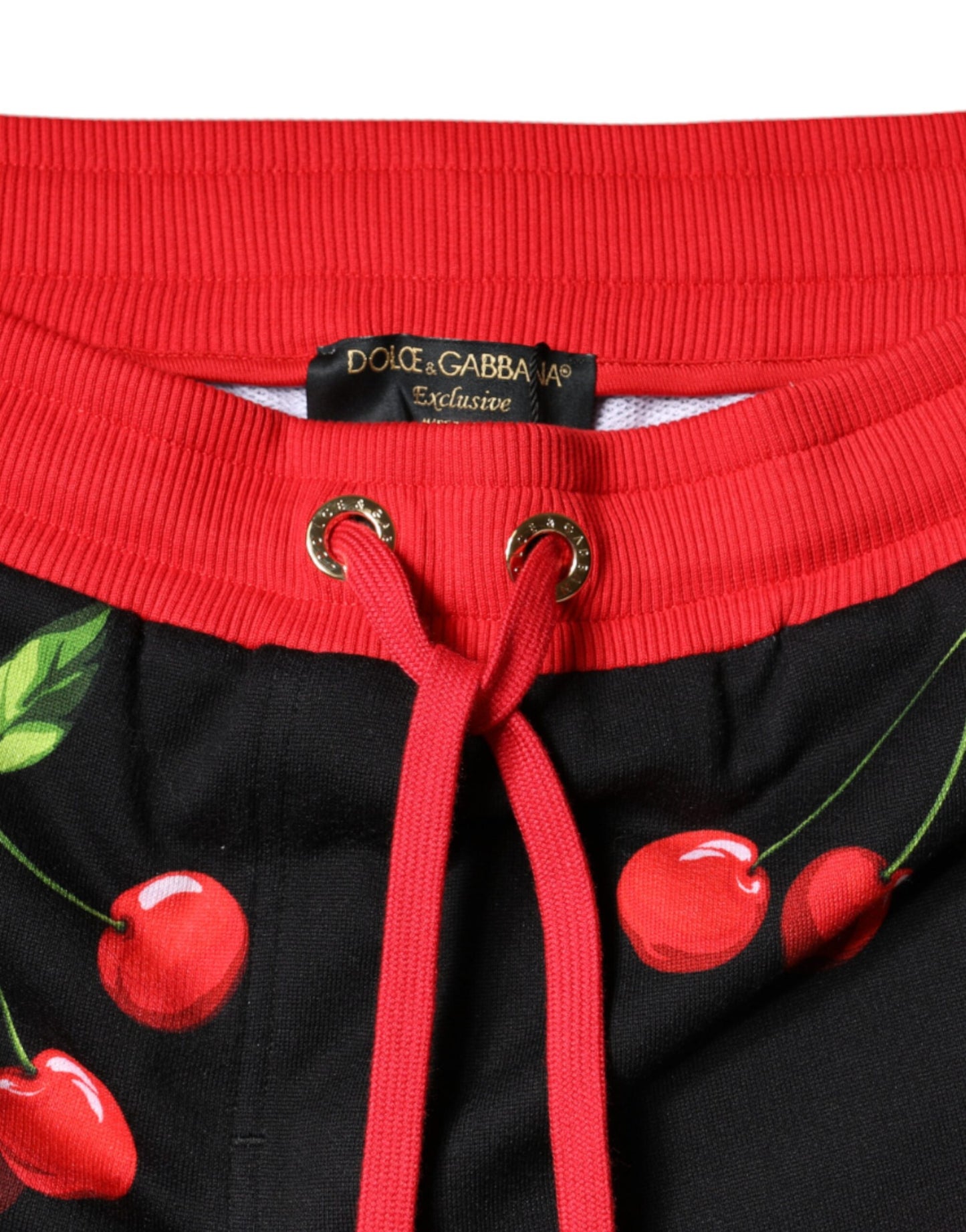 Pantalones deportivos de cintura media con estampado de cerezas rojas y negras