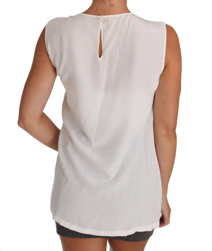 Elegante blusa sin mangas de seda blanca con detalle de encaje