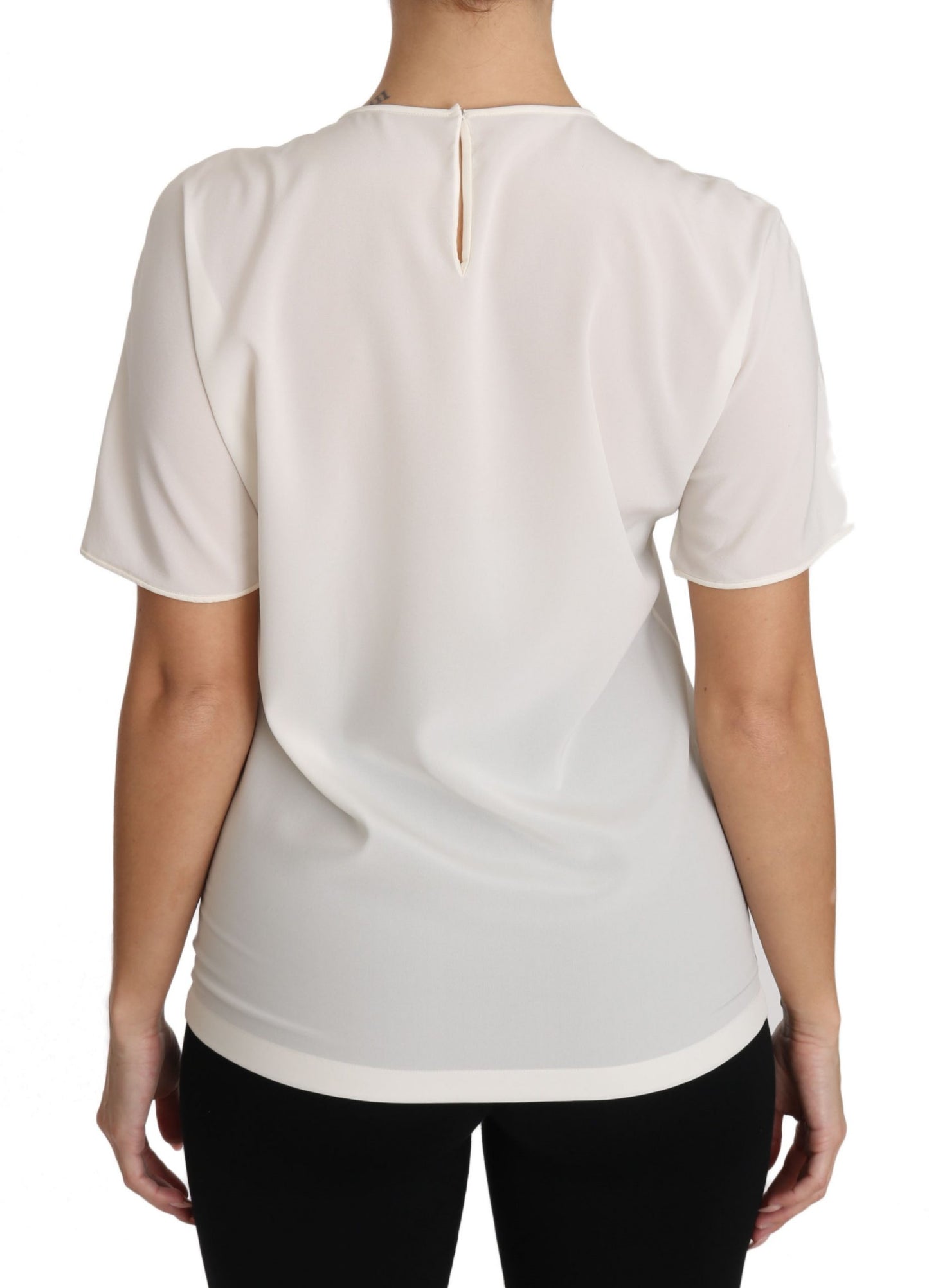 Elegante blusa de seda con cuello redondo y apliques