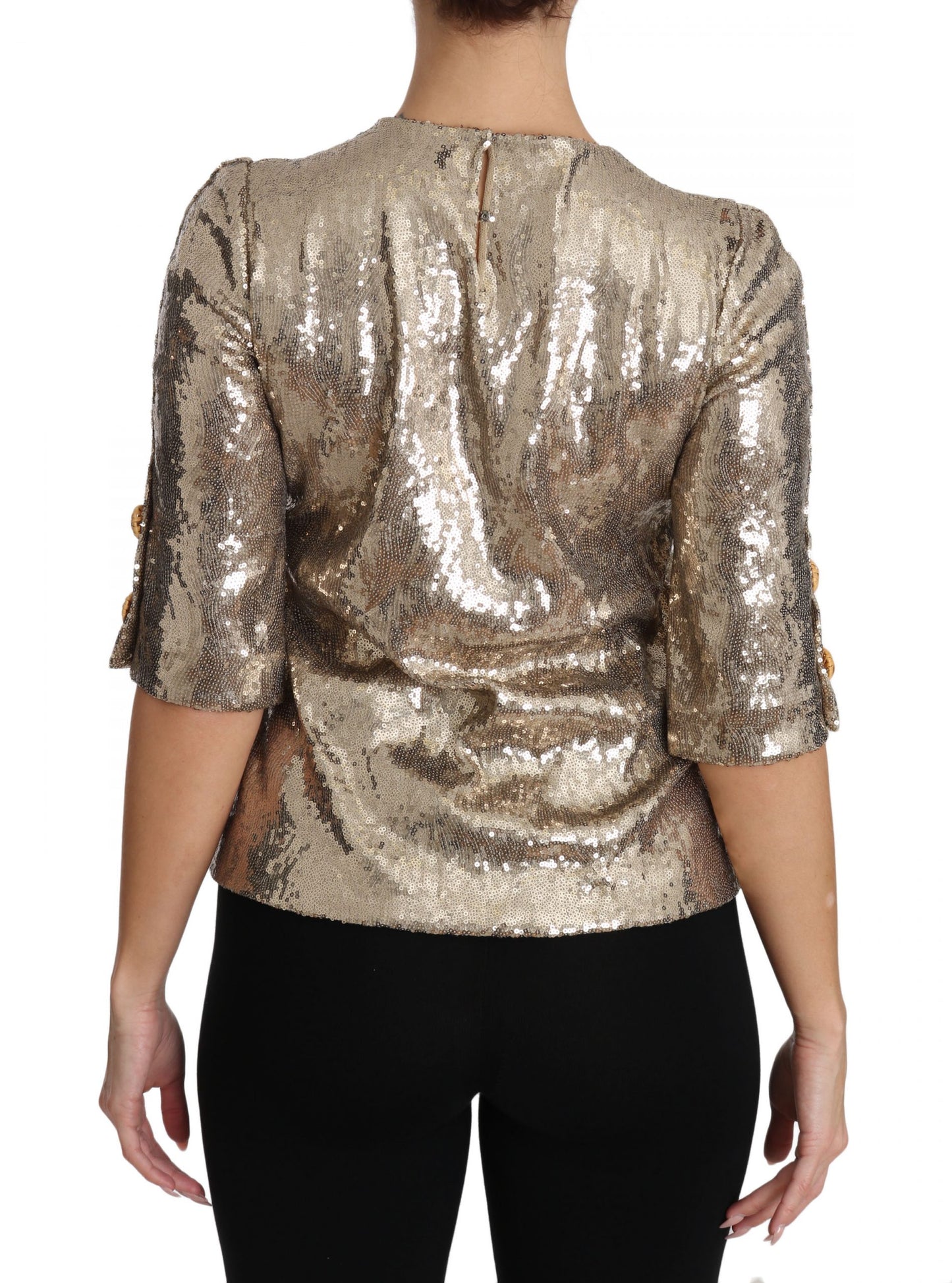 Blusa de cuello redondo con motivo de loro dorado y cristales